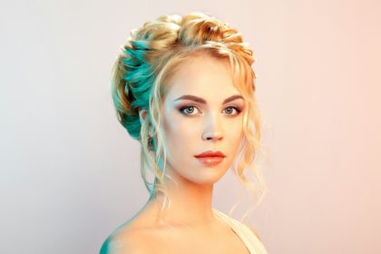 Blonde girl with long and shiny curly hair