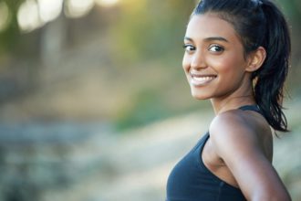 I run for fun and better health. Portrait of a sporty young woman exercising outdoors.